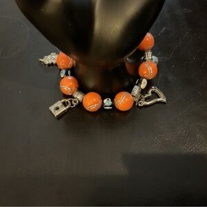 ORANGE BEADED CHARM & EYE BRACELET. GOOD CONDITION